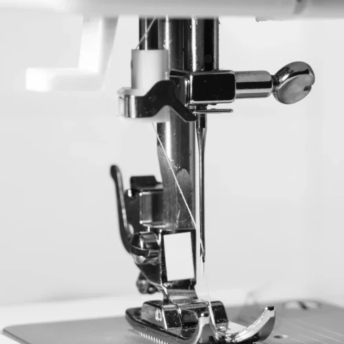 vertical-grayscale-macro-shot-sewing-machine-presser-foot